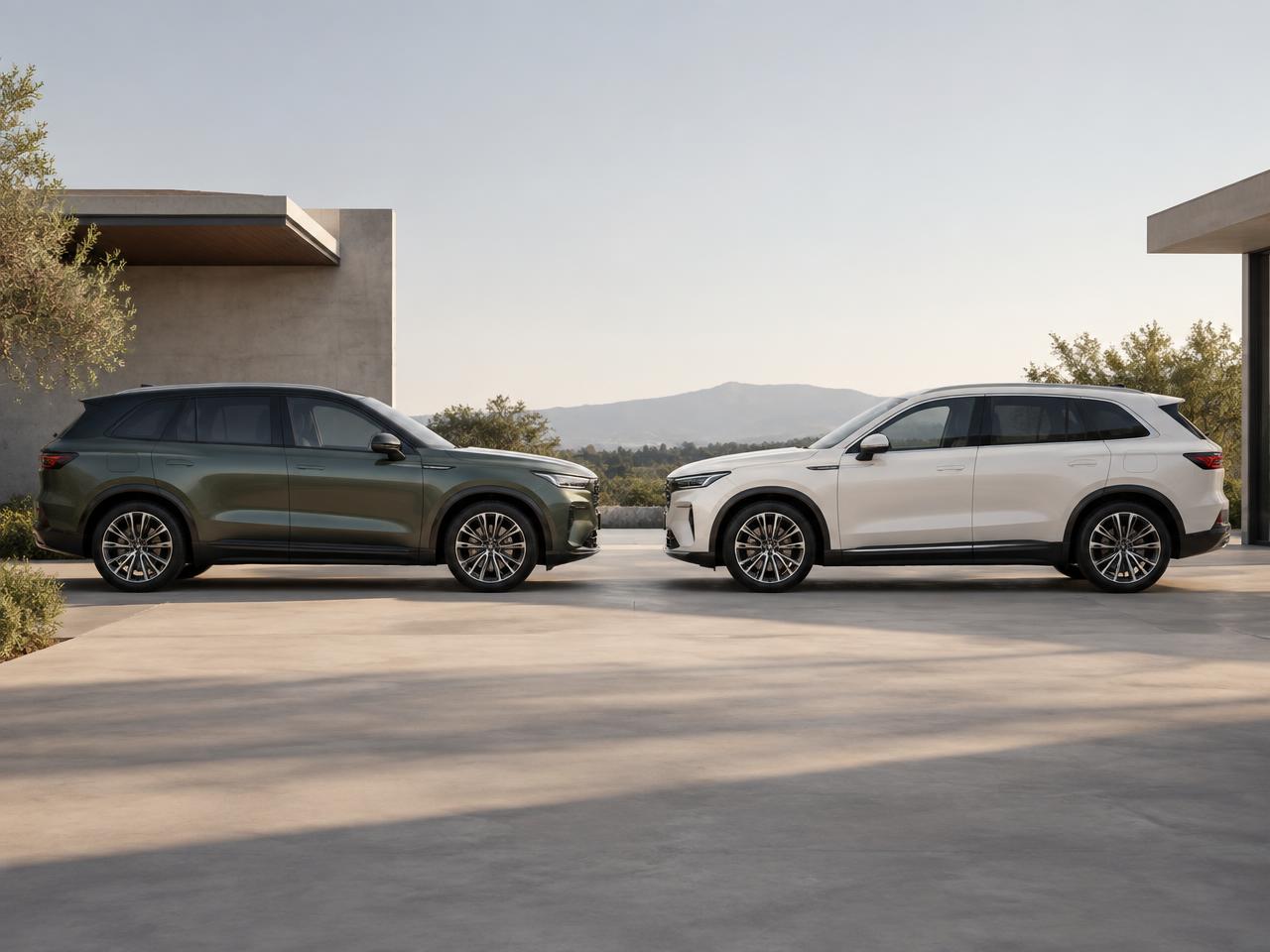 Two modern SUVs parked facing each other